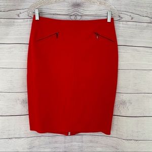 Red fitted skirt with decorative zippers